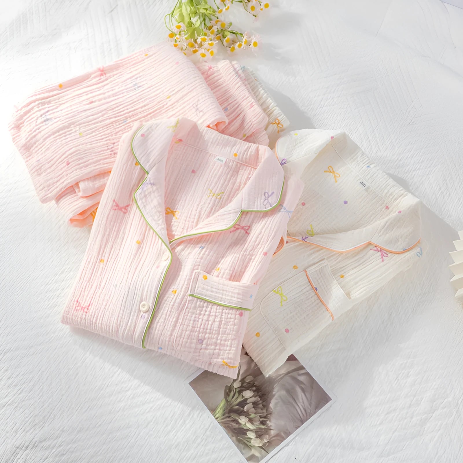 Women's thin cotton long-sleeve pajama set in pink, showing top and trousers.