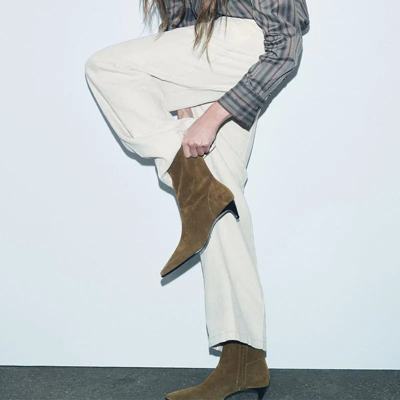 Brown square toe ankle boots with a side zipper and a mid-height kitten heel on a waterproof platform.