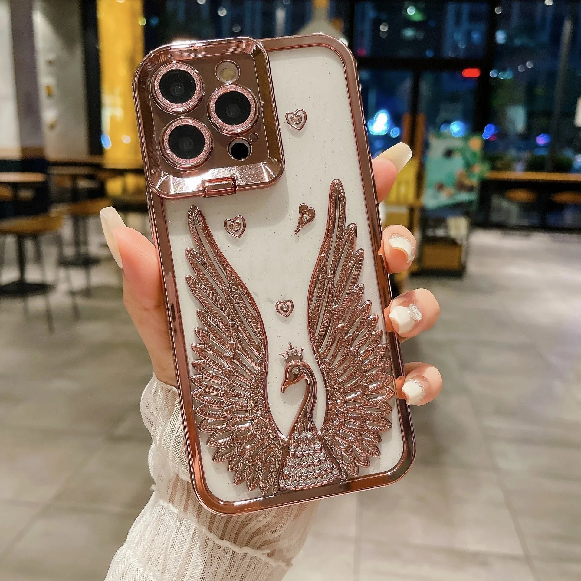 TPU phone case with electroplated three-dimensional angel wing frame and built-in invisible bracket, transparent back, shown in black