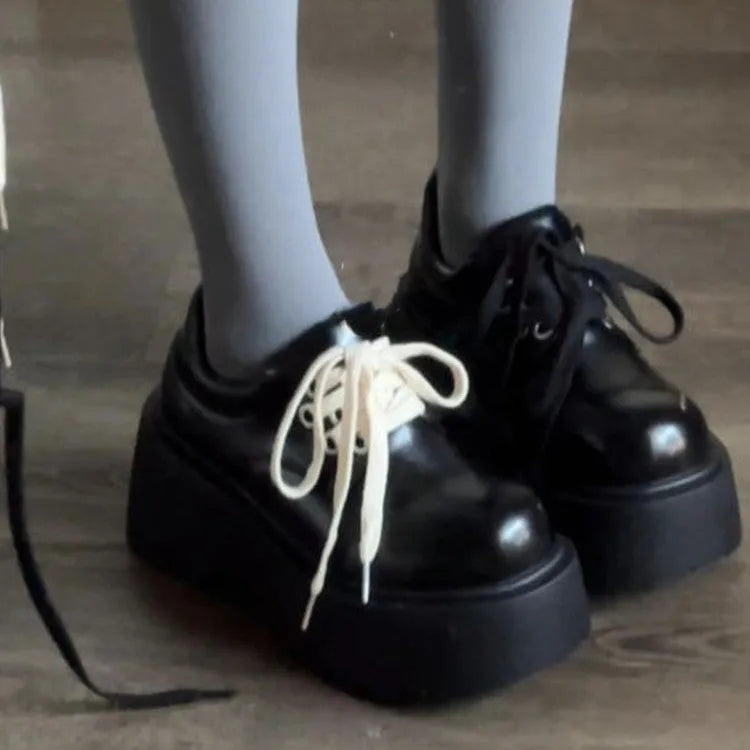 Matte black women's lace-up shoes with a chunky 6-8cm platform heel and round toe.