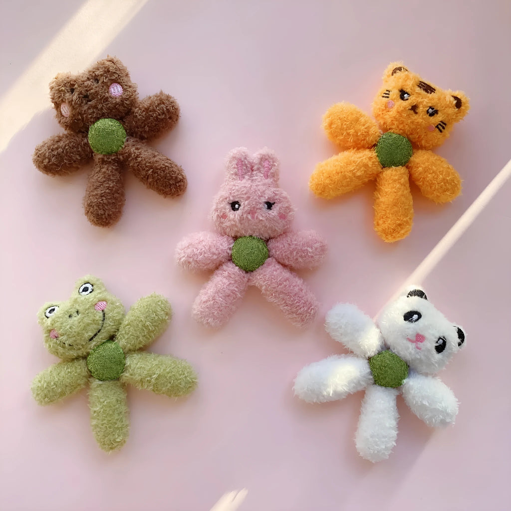 Soft brown bear-shaped catnip chewing ball toy for cats on a white background.