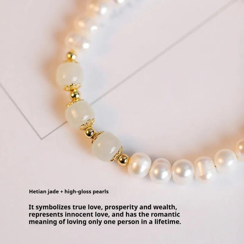 Close-up of a diamond-shaped freshwater pearl bracelet in an electroplated Hetian jade colour on a wrist.