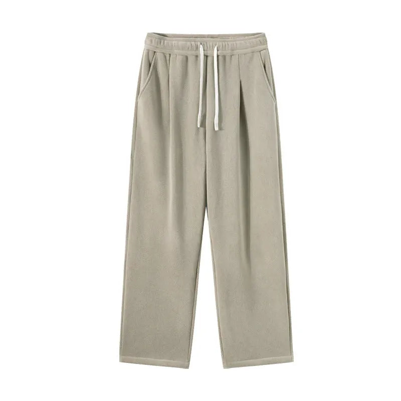 Men's apricot double-sided polar fleece-lined loose fit winter sports trousers on a hanger