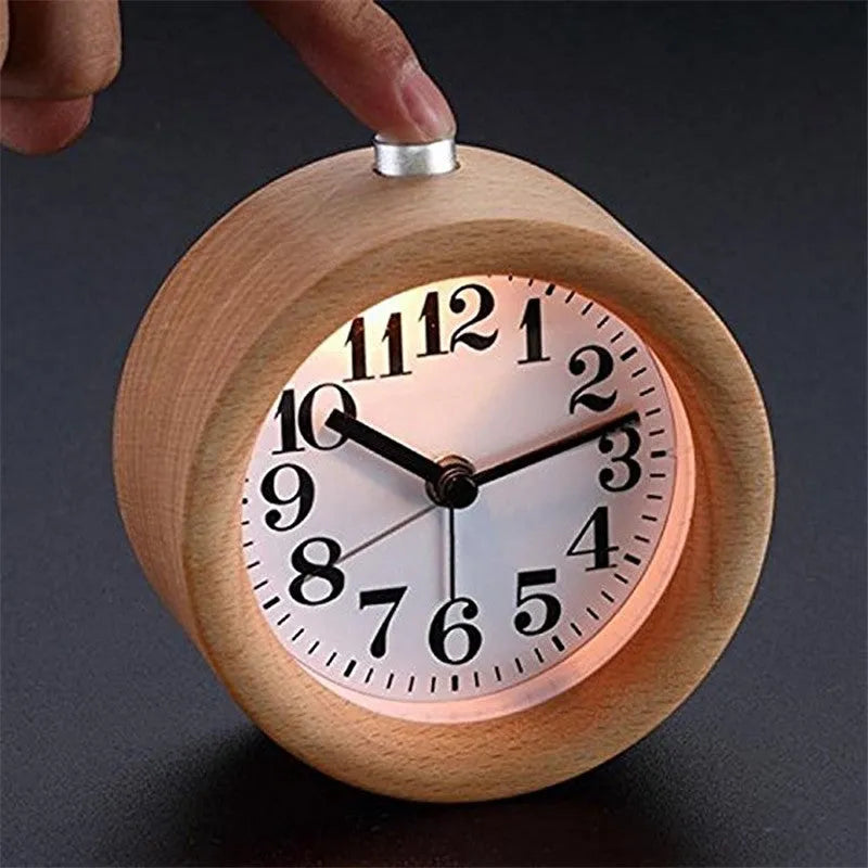 Solid beech wood silent snooze alarm clock showing wooden case and clear dial.