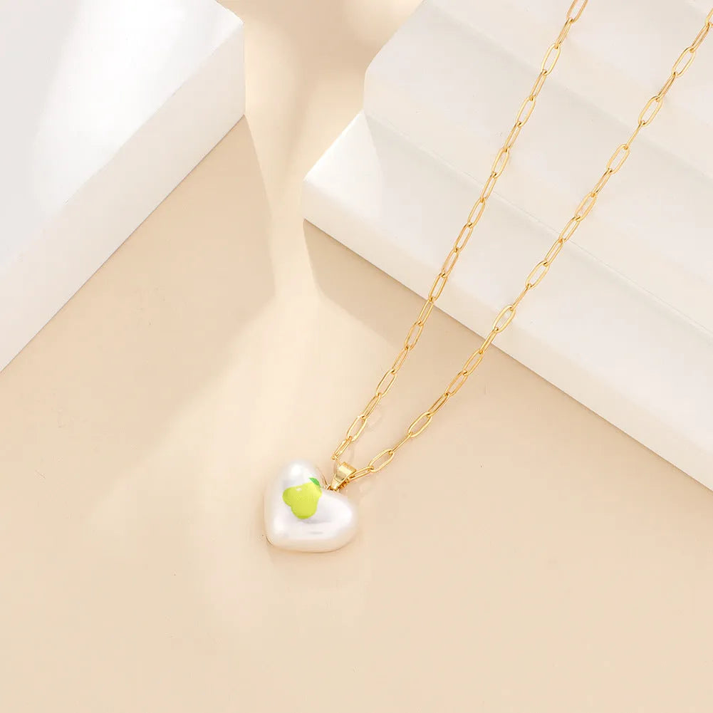 Adjustable heart-shaped necklace with fruit pendant charm showing five colour options