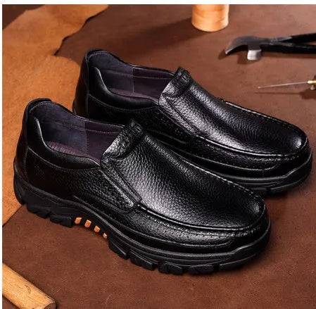 Men's black cowhide leather slip-on business casual shoes with a rubber sole