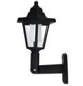 Black hexagonal solar wall light for outdoor mounting with automatic light sensor