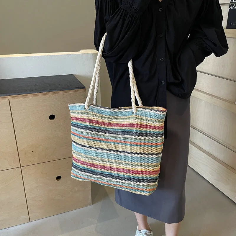 Blue straw woven large shoulder bag with an adjustable nylon strap