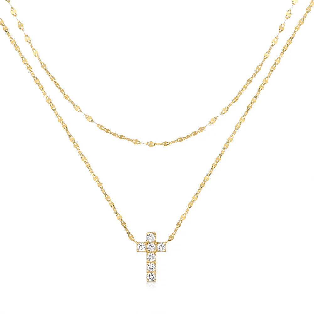 Sterling silver double layer twin diamond cross necklace on a clavicle chain, shown in gold tone.