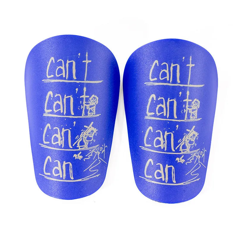 Football training shin guard in Pu material, colour black, size S, placed on grass