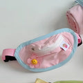 Powder blue and yellow adjustable pet carrier backpack worn on a person's back.