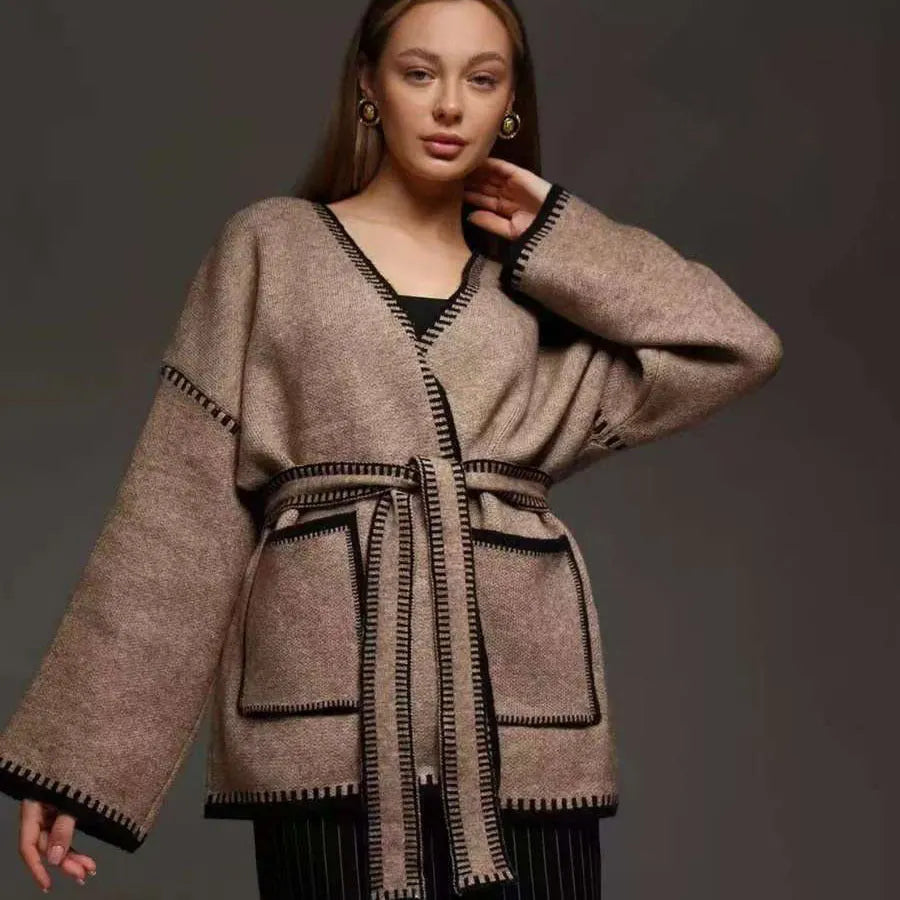 Loose fit knitted cardigan with lace-up sleeves in camel colour showing mid-length design