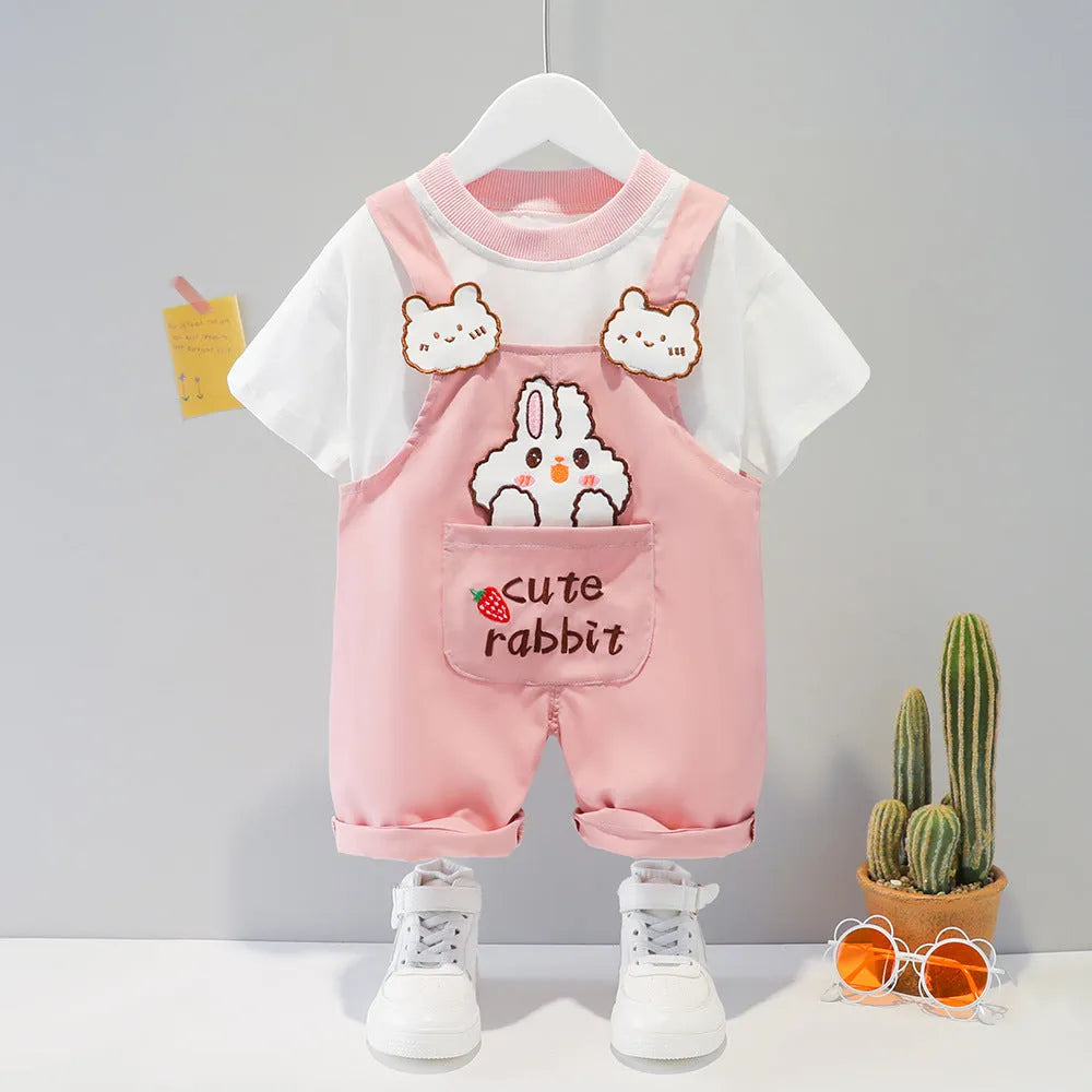 Baby wearing yellow cotton cartoon overalls with short sleeves and adjustable straps