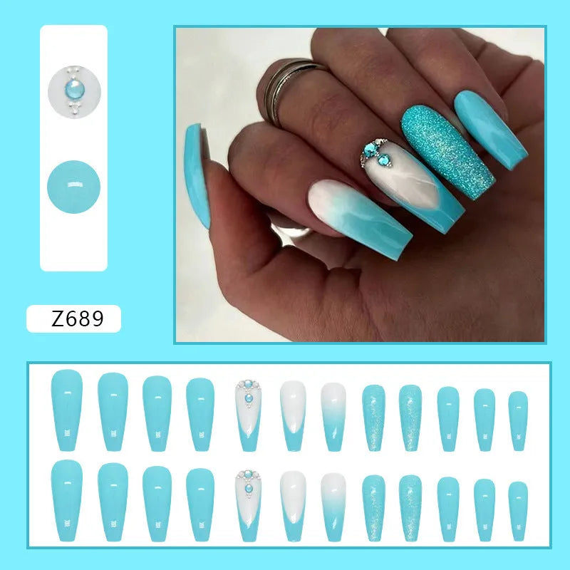 Long ballet shape press-on nails with smart blue diamond glitter pattern and glue