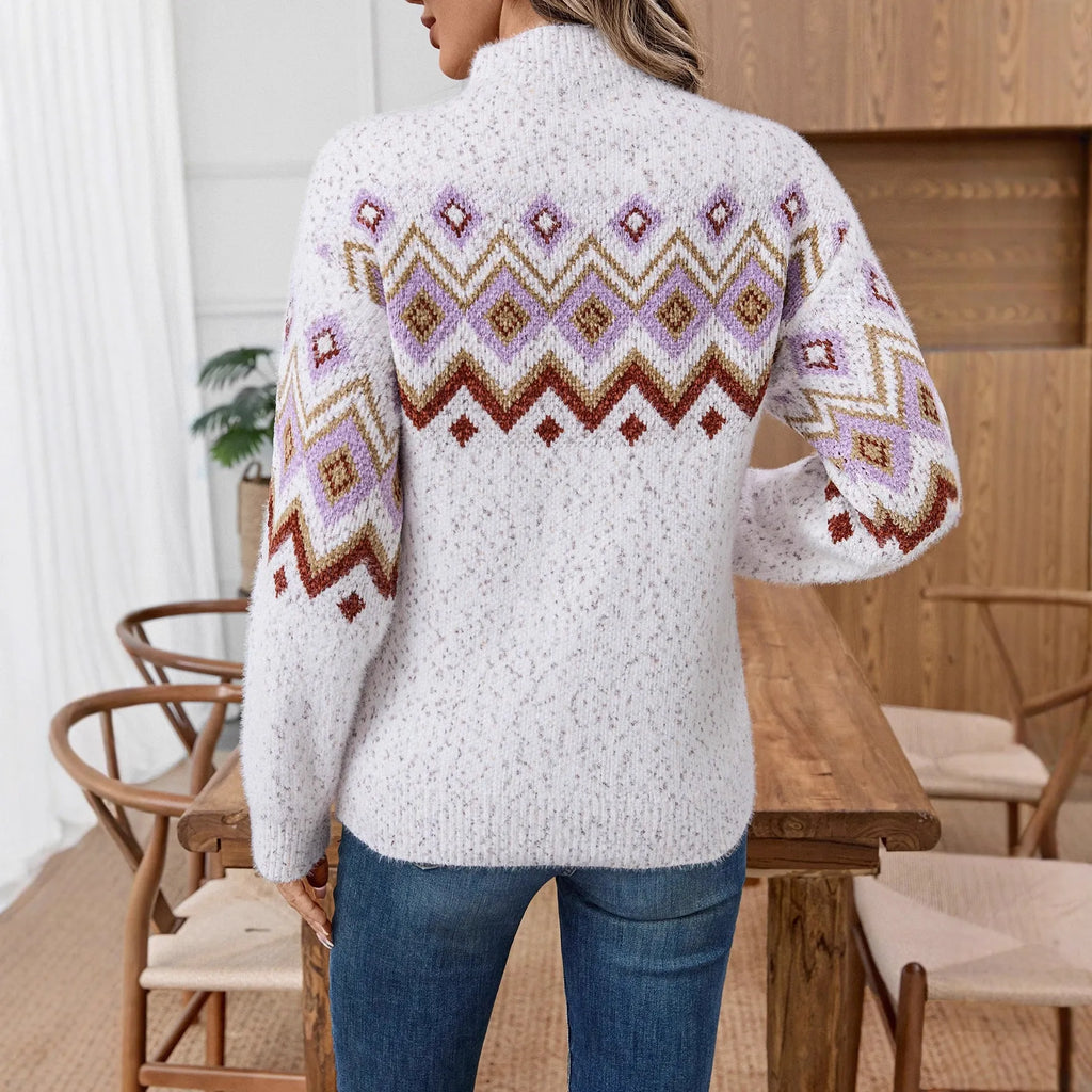 White loose half-turtleneck sweater with geometric jacquard pattern and long sleeves.