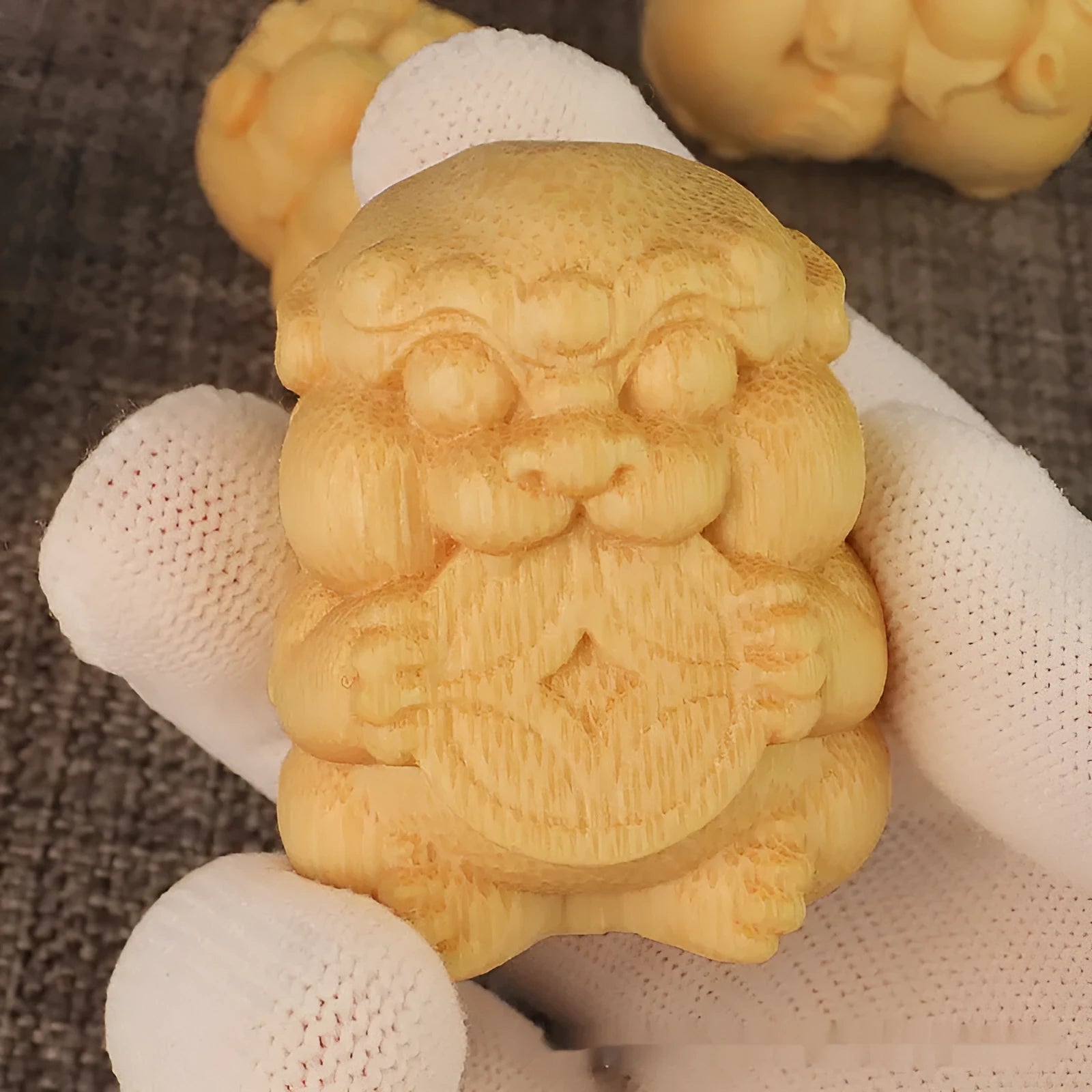 Solid bamboo carving ornament with traditional Take Money design measuring 4.5cm tall