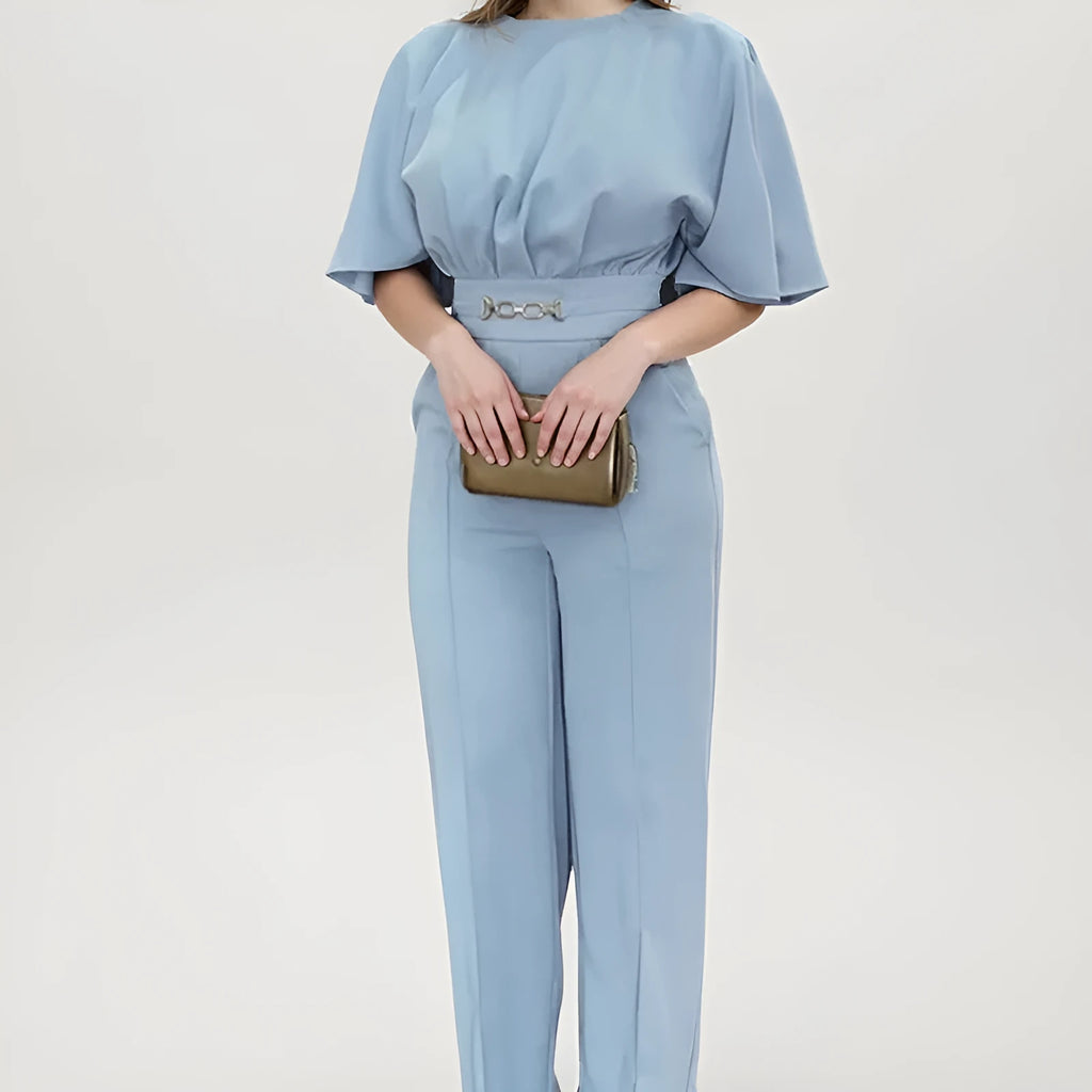 Blue polyester men's suit set with trousers and a long-sleeved top on a hanger