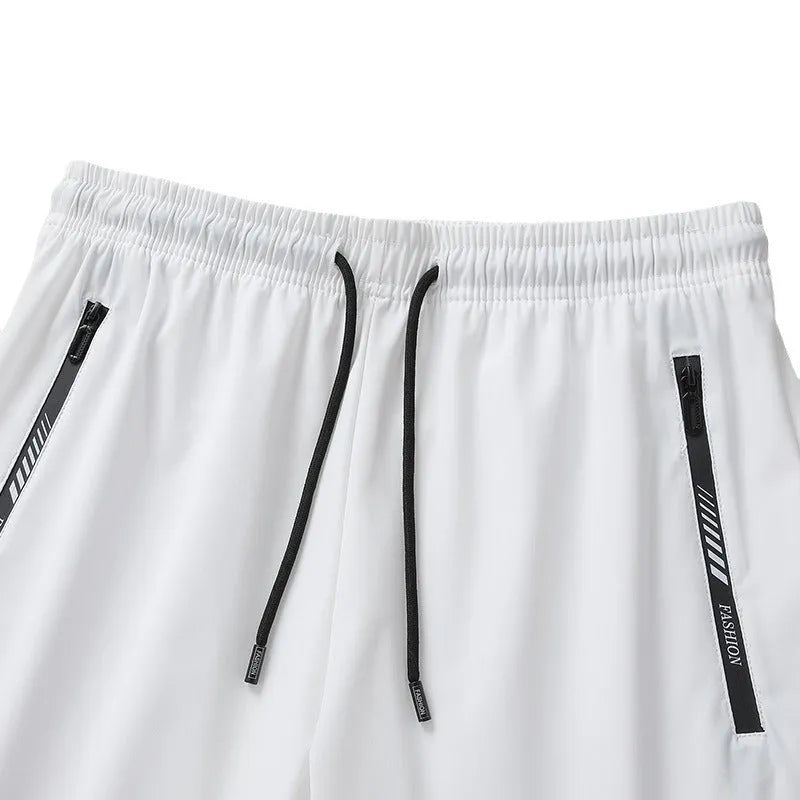 Men's black quick-dry nylon sports shorts with elastic waistband and loose fit design