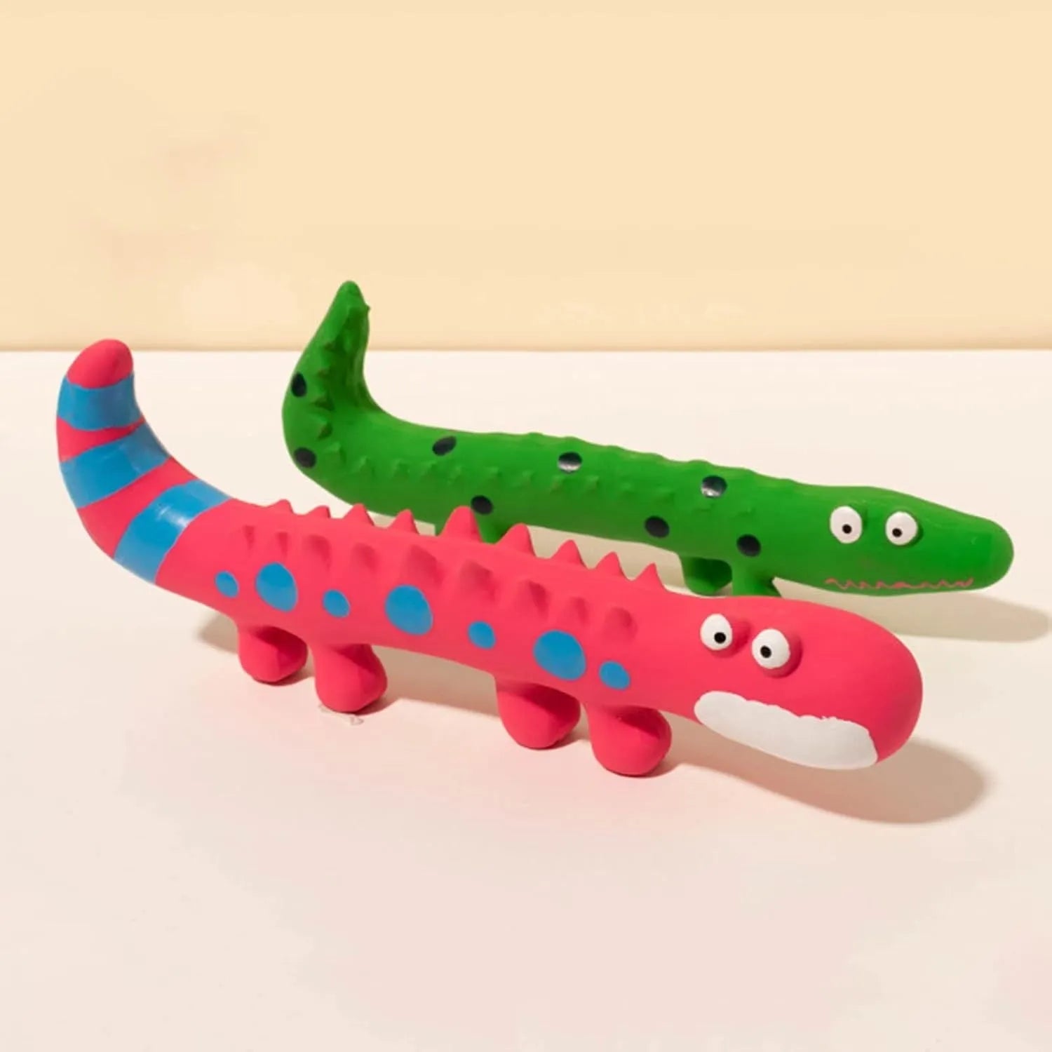 Green lizard-shaped dog chew toy with squeaker, measuring 24cm long