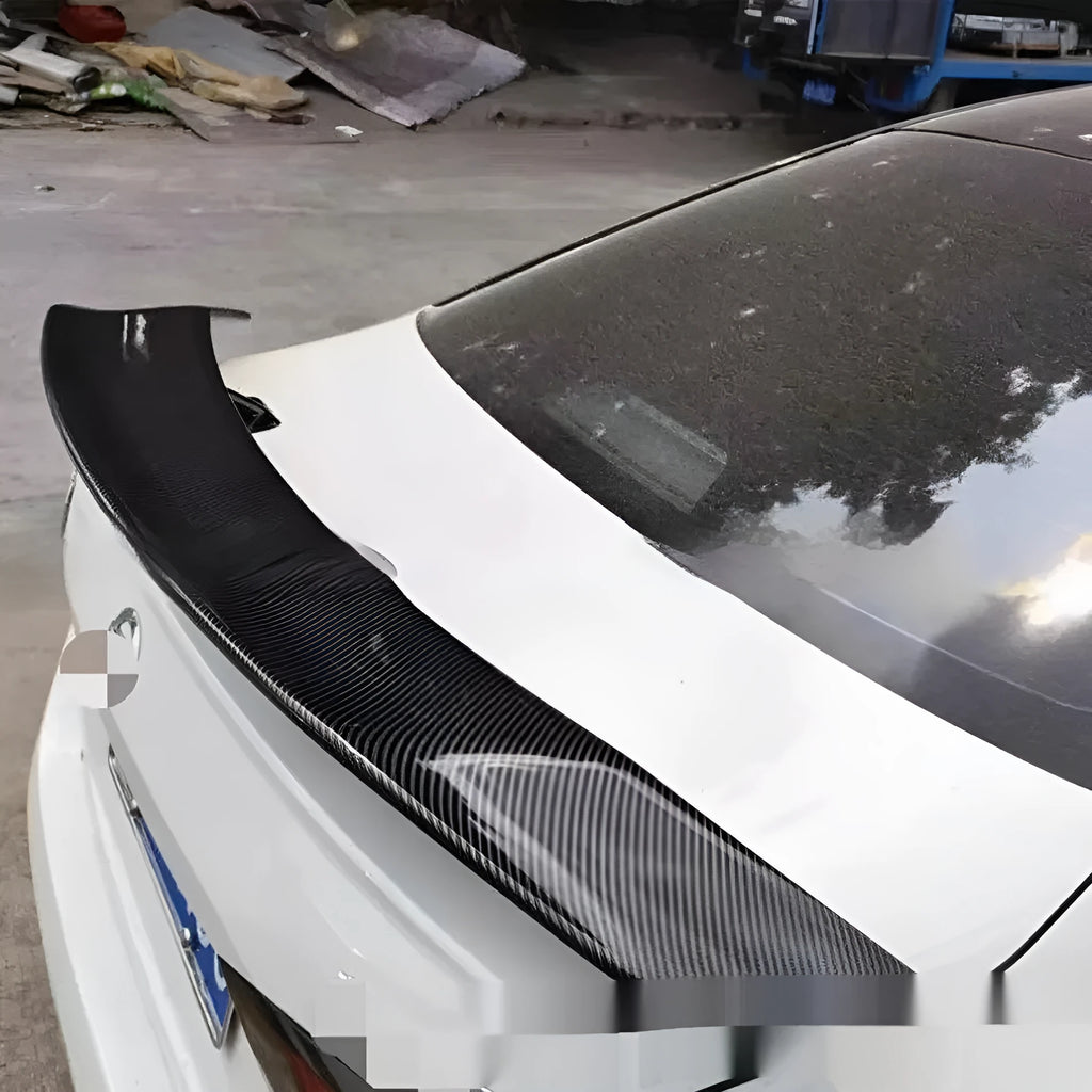 Universal punch-free car tail wing spoiler in ABS plastic shown in carbon pattern finish