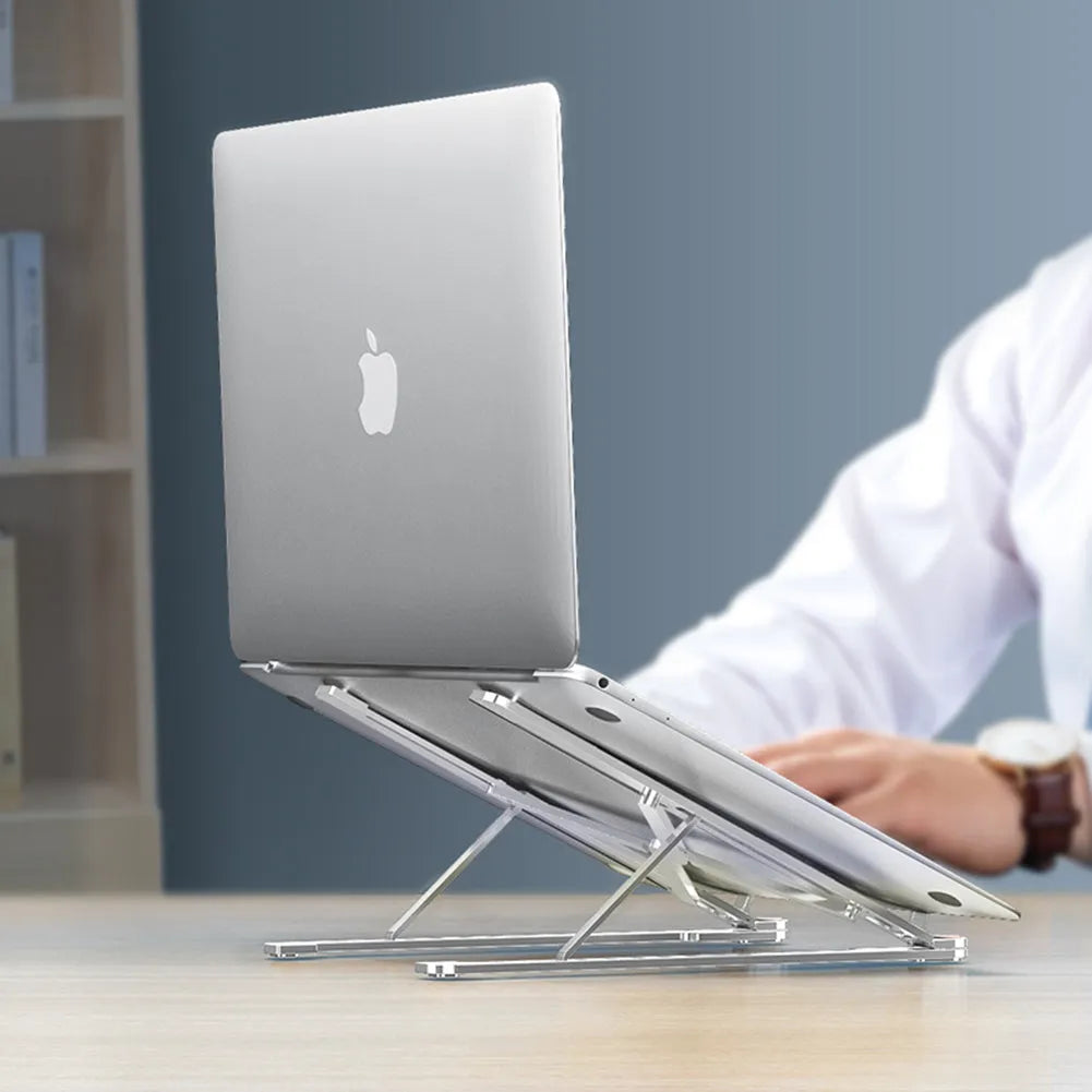 Foldable aluminium laptop stand in silver colour, shown in open and closed positions next to a laptop.