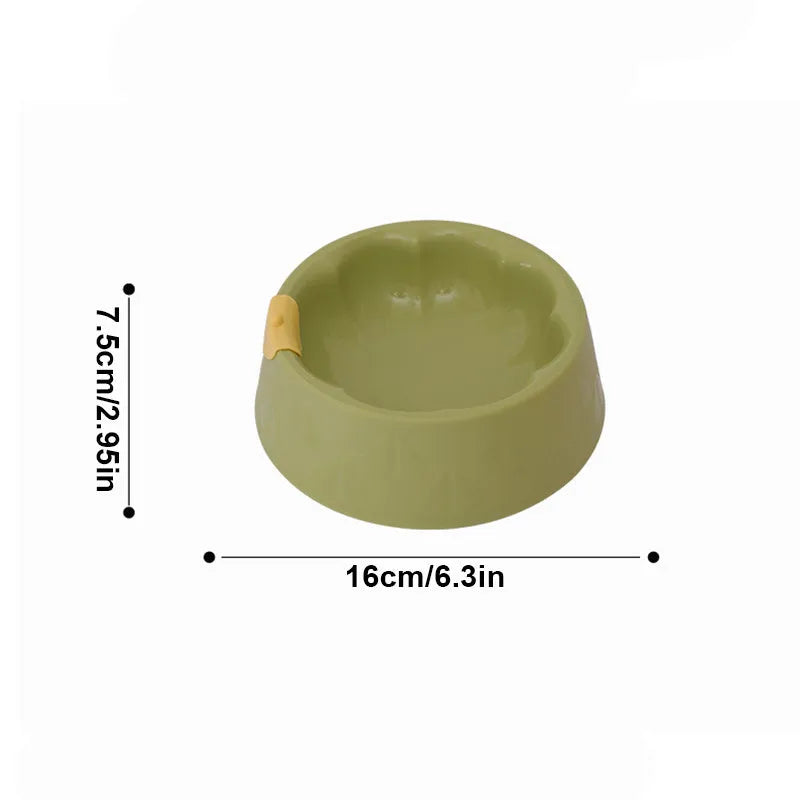 Green plastic double pet bowl with flower shape and separate food and water compartments.
