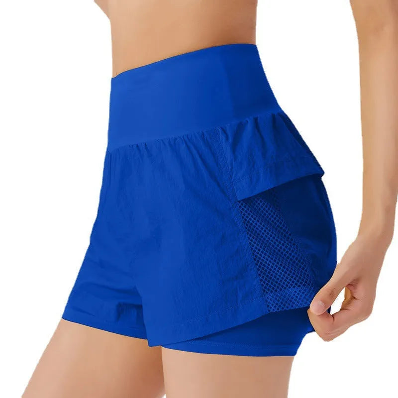 Women's loose cotton blend quick-drying sports shorts in lemon yellow colour.