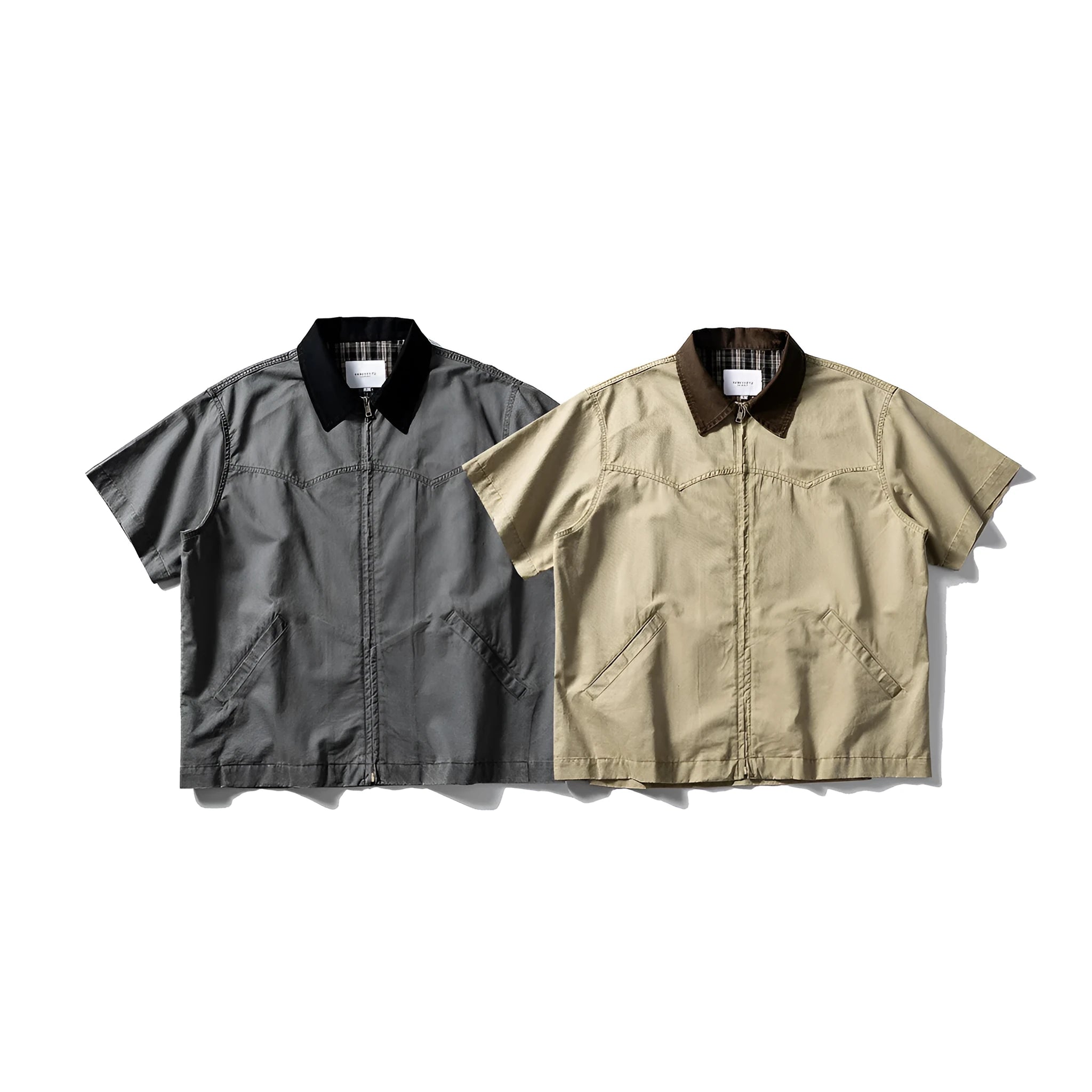 Washed khaki cotton overalls shirt with short sleeves and loose cardigan style on a hanger