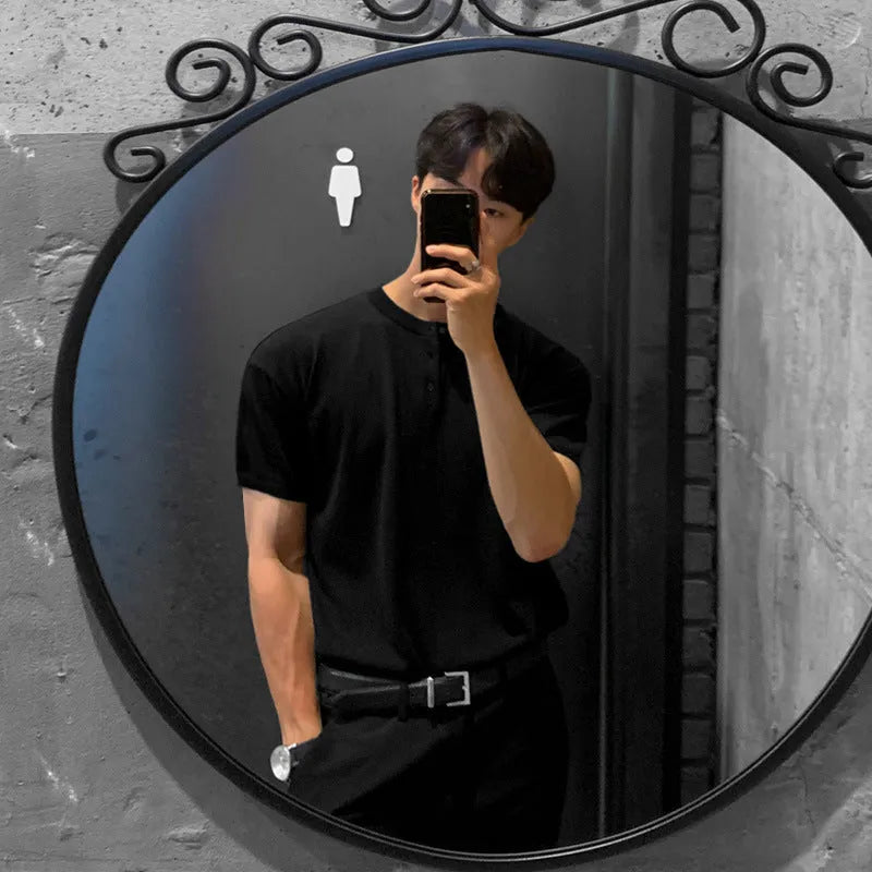 Men's slim-fit black ice silk knitted short-sleeved pullover shirt on a hanger.