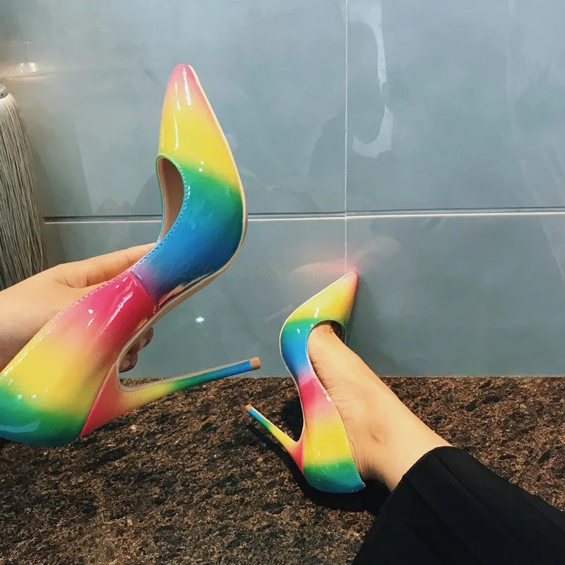 Rainbow coloured patent leather women's high heels with pointed toe and thin ultra-high heel.
