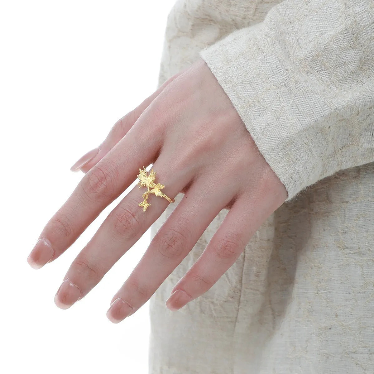 Adjustable silver ring with a detailed wild butterfly design in a white gold or 18K gold colour finish.