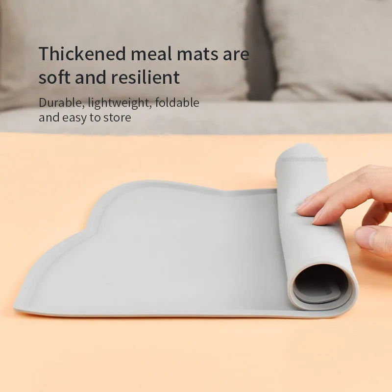 Silicone waterproof pet feeding mat with cat head design measuring 44x24cm in solid colours