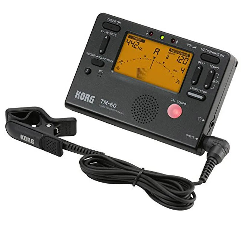 TM-60 black and white plastic electronic metronome tuner with digital display.