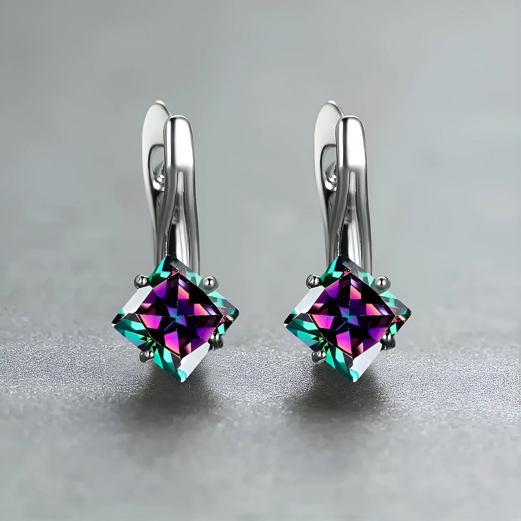 Women's copper earrings with a diamond design and inlaid blue zircon stones.