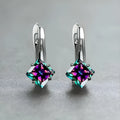 Women's copper earrings with a diamond design and inlaid blue zircon stones.
