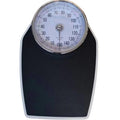 Black mechanical bathroom scale with large analogue dial showing weight measurement