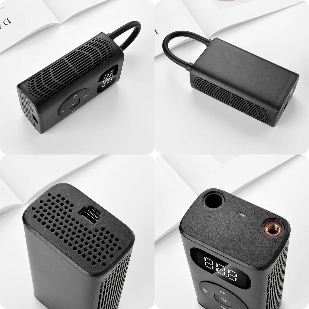 Black portable digital tyre inflator with power bank, USB cable, and 16cm tube on a grey background.