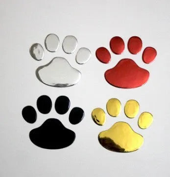PVC hand-shaped brush dog footprint car sticker on a vehicle bumper in black colour.
