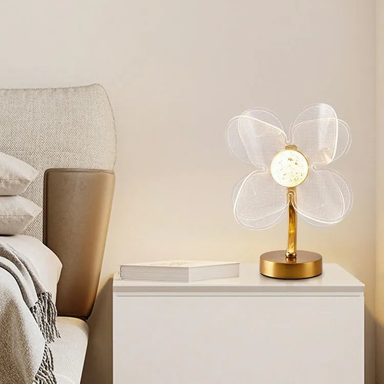 Creative acrylic table lamp with three-colour USB dimming, sunflower shape, on a desk