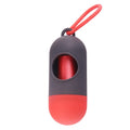 A small, square black plastic dog poop bag holder with a metal hook and Velcro strap.