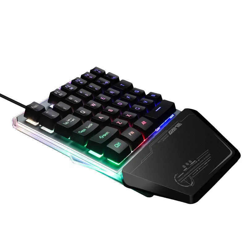 Black G40 Flow Colour one-handed mechanical keyboard with RGB backlit keys on a desk.