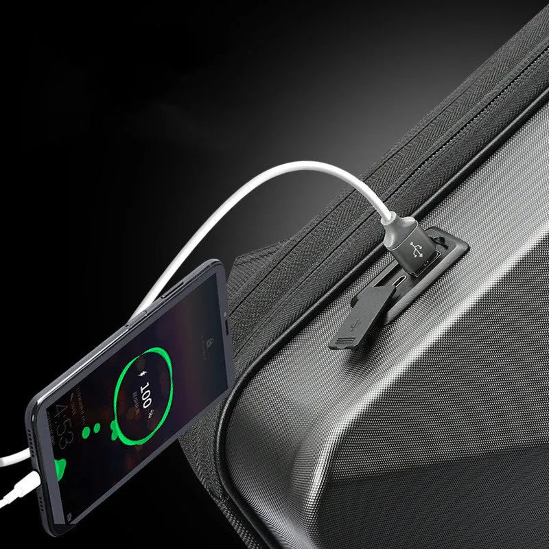 Large black or silver hard shell PC gaming backpack with lock, showing internal organisation pockets.