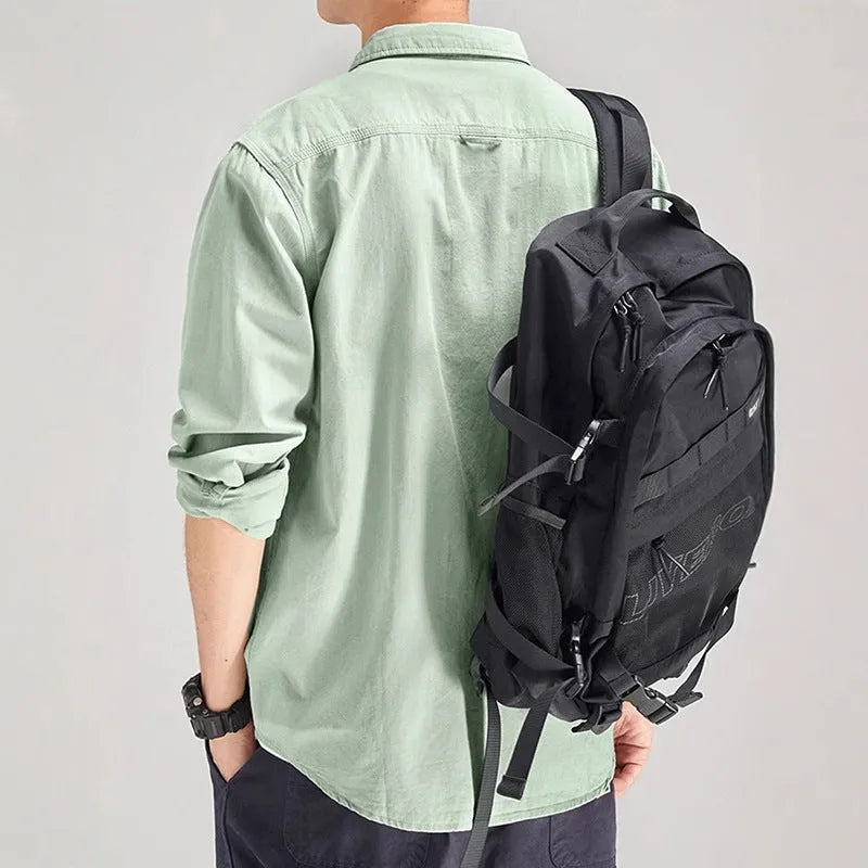 A man's loose-fitting long sleeve cardigan shirt in light grey, black, khaki, or green.