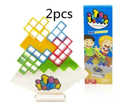 Plastic balance stacking game with coloured blocks on chassis for family play