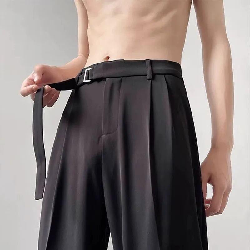 Black straight leg wide trousers with loose fit and non-iron chemical fibre fabric in solid colour.