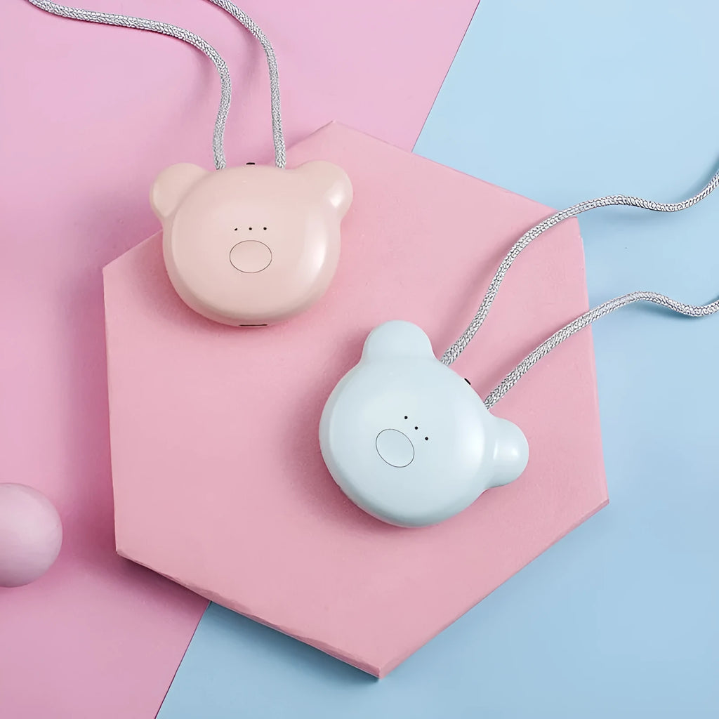 Mini USB portable air purifier necklace in pink, showing compact design with single button.