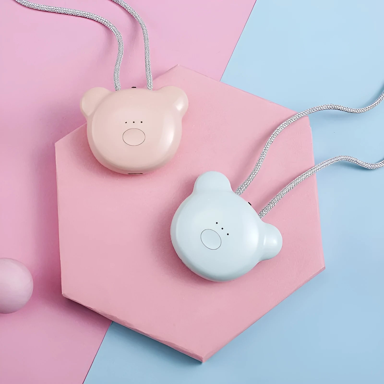 Mini USB portable air purifier necklace in pink, showing compact design with single button.