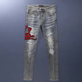 Old colour slim fit jeans with worn looking washed-out finish and trendy hole patch embroidery details