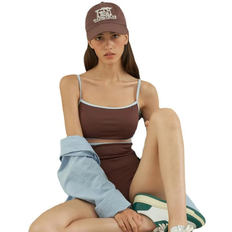 Brown triangle one-piece swimsuit for women on a hanger, showing sexy style and nylon fabric.