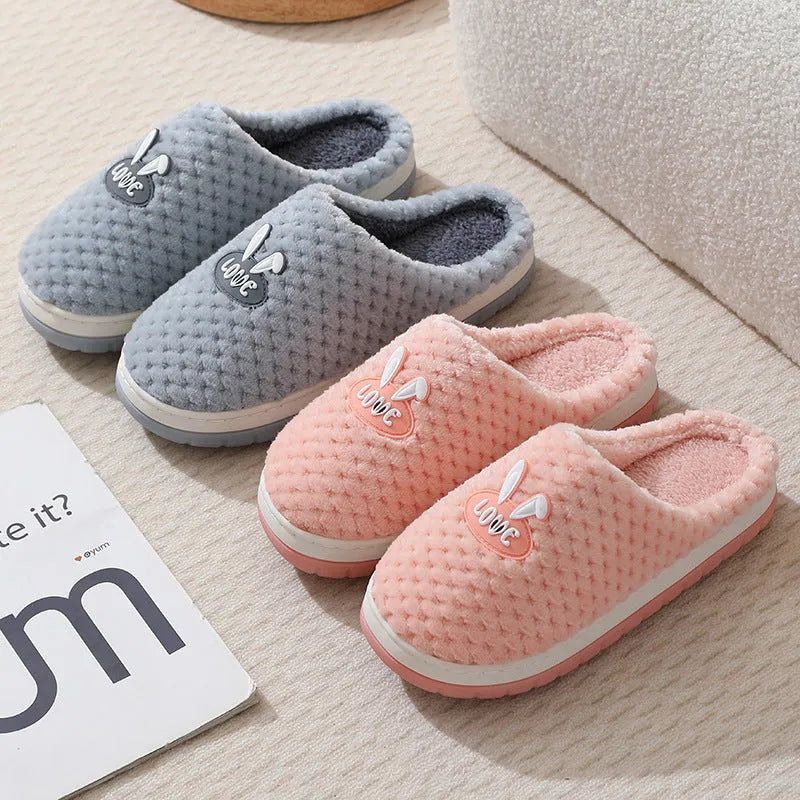 Women's rabbit plaid design artificial fur house slippers with thick rubber soles in apricot colour.